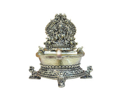 Brass Lakshmi oil lamp diya with decorative canopy and wide rim, front close-up