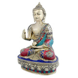 Brass Buddha statue in Abhaya mudra; raised hand, teal red blue mosaic robe