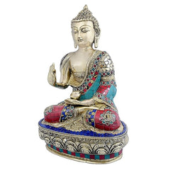 Brass Buddha statue in Abhaya mudra; raised hand, teal red blue mosaic robe