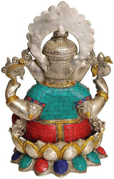 Brass Ganesha idol, reverse view: arms raised, teal and red patterned garments