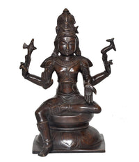 Lord Shiva idol statue, seated posture with multi-armed hands holding tridents, dark brass tone