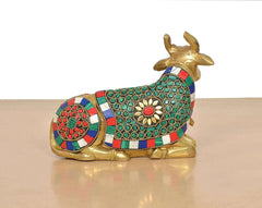 Brass seated Nandi statue rear view, striped jeweled blanket with circular medallions