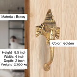 Golden brass Ganesha face door handle with curved lever and visible mounting screws
