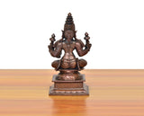 Copper Lakshmi Maa idol rear view, multi-armed seated on square base, copper finish