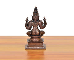 Copper Lakshmi Maa idol rear view, multi-armed seated on square base, copper finish