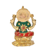Brass Lakshmi idol statue back view, green top and red skirt with gold detailing