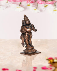 Copper Garuda idol statue, angled view with folded hands and detailed costume, 3.5 in