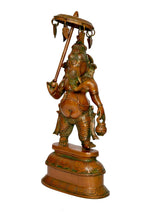 Brass Ganesha idol sculpture with parasol, side view, raised hand and pedestal