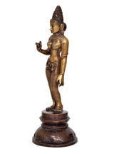 Brass Parvati statue, side view with raised hand, intricate patterns on legs and base