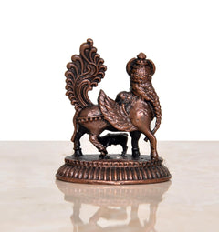 Copper Kamadhenu cow statue profile with wing fan, ornate detailing, circular base.