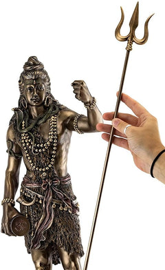Shiva trishul figurine with trident raised, bronze-tone, scale with hand for size