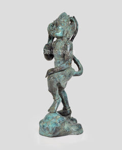 Hanuman Ji bronze statue side view, turquoise patina, one hand extended with mace raised