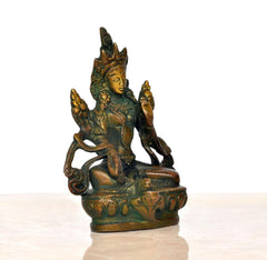 Brass Green Tara statue from back angle, seated lotus with detailed arms and headdress