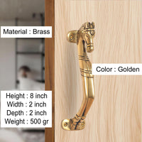 Golden brass horse head door handle on light wood door, with curved lever