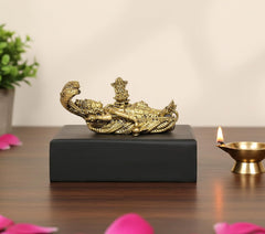 Vishnu idol reclining on Sheshanaag, gold tone, on black base (1 inch)