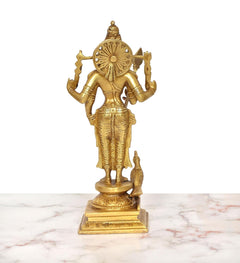 Brass Kartikeya idol with circular back disc and ornate arms, rear view