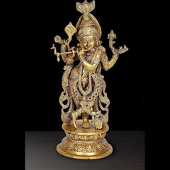 Krishna flute-playing idol, multi-plated golden finish, ornate pedestal base.