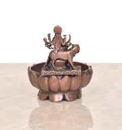 Copper Durga Maa urli bowl, rear angle showing seated deity figure on horse mount