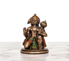 Resin Hanuman JI idol, frontal view—seated blessing pose with raised hand and ornaments.