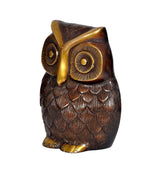Side view brass owl decor with textured feathers and gold beak highlight.