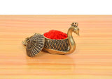 Brass duck kumkum box with domed lid and red powder-filled bowl, small side holder