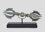 Bronze eight-pronged small Dorje on black wooden base, turquoise patina, front view