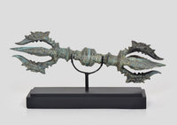Bronze eight-pronged small Dorje on black wooden base, turquoise patina, front view