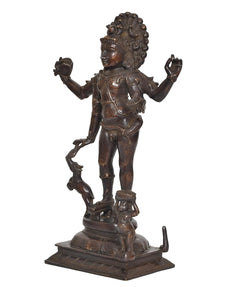Brass-toned Bhikshatana Shiva sculpture, side view with ornate head and outstretched hands