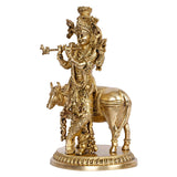 Brass Krishna and cow statue, other side view showing flute and filigree clothing