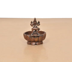 Krishna urli bowl showpiece rear view, copper basin with deity figurine on stem