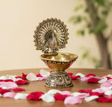 AONA brass peacock designer diya: ornate peacock over oil cup, 4-inch height