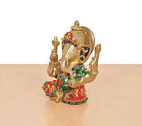 Brass Ganpati idol, side view with decorated crown and multicolor enamel garments