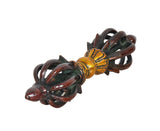 Angle view of small eight-pronged dorje: dark brown prongs with gold mid-bands