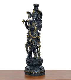 Lord Krishna figurine playing flute, rear three-quarter view, intricate dark brass detailing