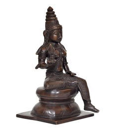 Bronze Parvati statue from side, seated with extended leg and intricate ornaments