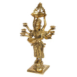 Gold brass standing lady holding top diya tray above head, with eight bowls in hands