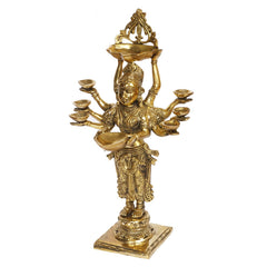 Gold brass standing lady holding top diya tray above head, with eight bowls in hands