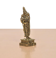 Angled rear view of standing Lord Balaji idol with sculpted crown, bronze finish