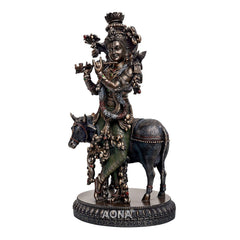 Resin Lord Krishna on dark cow figurine, lifted hand pose, round ornate pedestal