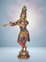Krishna brass statue with raised flute, colorful embroidered outfit and jeweled crown