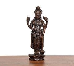 Brass Lord Vishnu idol front view, ornate jewelry, crown, and four-armed stance