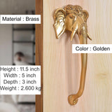 Brass door handle pair with Ganesha-face design; golden handles and curved lever