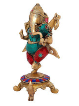 Brass Dancing Ganesha idol with raised hands, turquoise top, red dhoti, jeweled trim