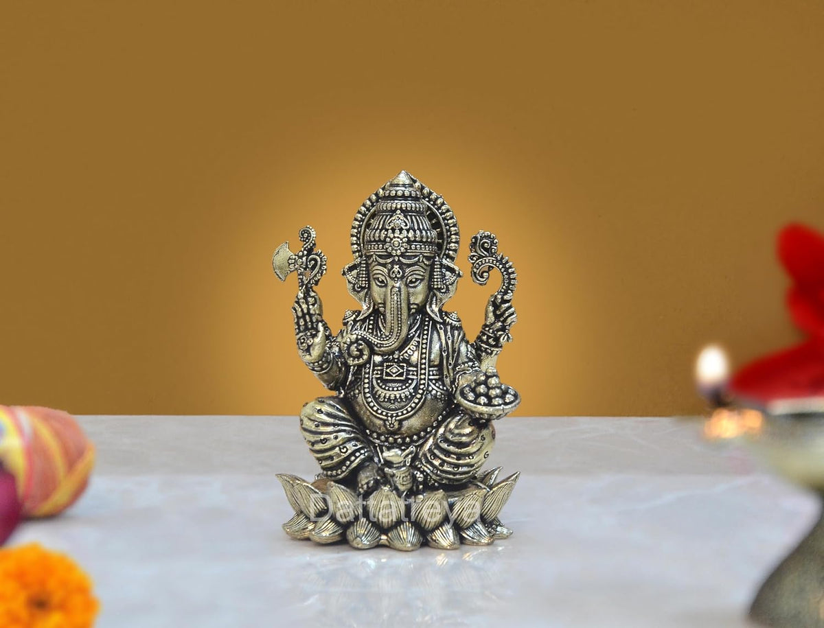 Brass Lord Ganesha idol on lotus base, front view, ornate jewelry, 3 in tall
