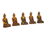 Five brass Buddha statues seated in a row, gold faces and patterned green-brown robes
