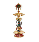 Brass shankh chakra oil lamp diya idol with four-bowl tier and painted green-red dress