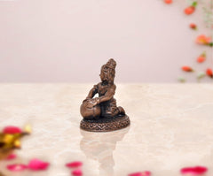 Copper Lord Bal Gopal Krishna idol statue, side/back view seated on patterned round base