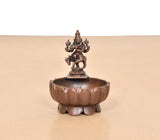 Krishna urli bowl showpiece front view, round basin with deity figurine on top pedestal
