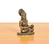Bronze Maa Annapurna Devi figurine, angled view, seated meditating with detailed robe
