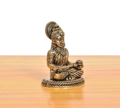 Bronze Maa Annapurna Devi figurine, angled view, seated meditating with detailed robe